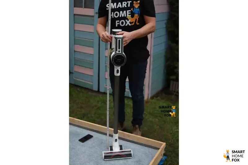 The Tineco S12 PureOne stick vacuum is being measured.